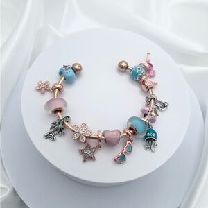 Linx Stainless Rose Gold Open Bangle with Pink and Blue Beach Themed Charms